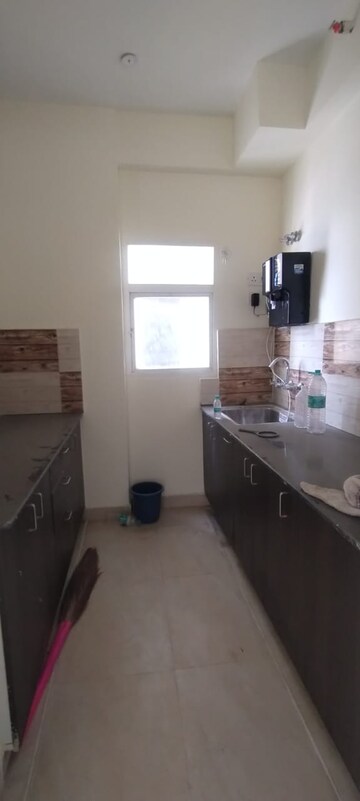 Kitchen in 2 BHK Apartment at Amrapali Enchante, Tech Zone 4 Greater Noida – for Rent
