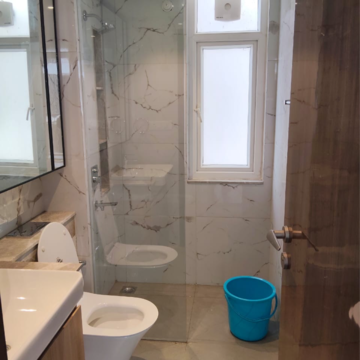 Bathroom in 4 BHK Apartment at Ansal Height 86, Nawada Fatehpur – for Rent