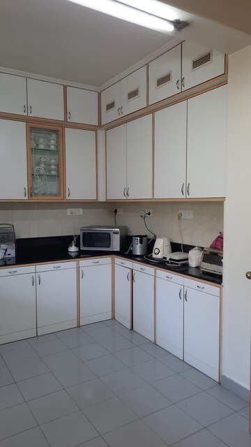 Kitchen in 3 BHK Apartment at Marble Arch CHS, Model Colony – for Rent