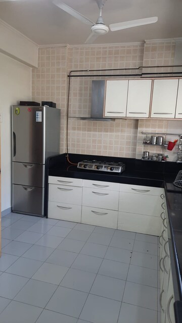 Kitchen in 3 BHK Apartment at Marble Arch CHS, Model Colony – for Rent