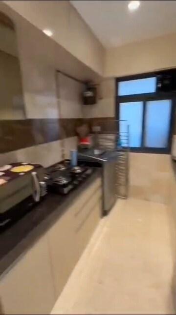 Kitchen in 2 BHK Apartment at Andheri CHS, Andheri West – for Rent
