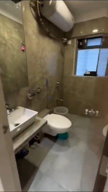 Bathroom in 2 BHK Apartment at Andheri CHS, Andheri West – for Rent