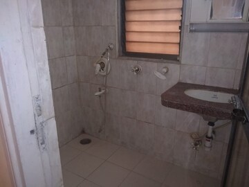 Bathroom in 1 BHK Apartment at Rustomjee Regal, Dahisar West – for Rent