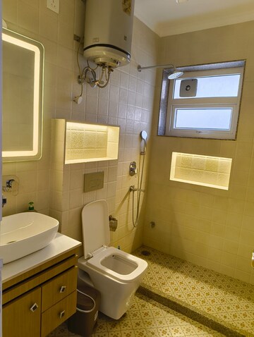 Bathroom in 4 BHK Apartment at Geetanjali Enclave – for Rent