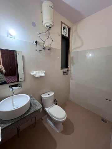 Bathroom in 4 BHK Apartment at Ansal Sushant Lok I, Sector 43 – for Rent