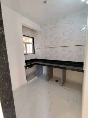 Kitchen in 1 RK Apartment at Agarwal Krish Garden, Nalasopara West – for Sale