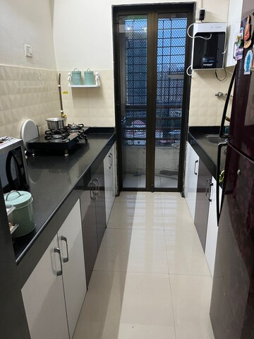 Kitchen in 2 BHK Apartment at Hubtown Greenwoods, Vartak Nagar – for Sale