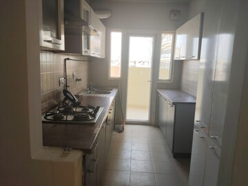 Kitchen in 2.5 BHK Apartment at Mahagun Moderne, Sector 78 – for Rent