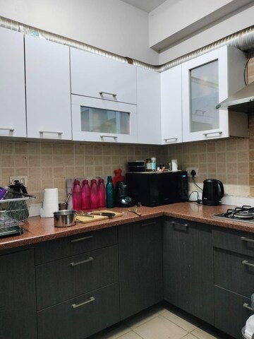 Kitchen in 3 BHK Apartment at Mahagun Moderne, Sector 78 – for Rent
