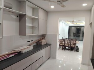 Kitchen in 4 BHK Apartment at Tata Raheja Raisina Residency, Sector 59 – for Sale