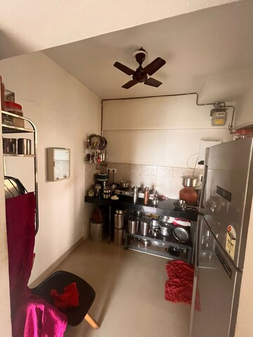 Kitchen in 1.5 BHK Apartment at Runwal Garden City, Balkum Pada – for Sale