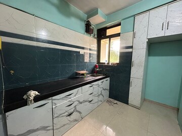 Kitchen in 1 BHK Apartment at Sai Baba Vihar Complex, Ghodbunder Road – for Sale