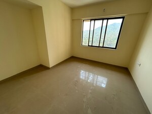 Room in 2 BHK Apartment at Pushpanjali Heights, Owale – for Sale