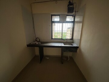 Kitchen in 1 BHK Apartment at Raunak Unnathi Greens, Kasarvadavali – for Sale