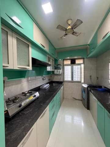Kitchen in 2 BHK Apartment at Azad Nagar Sangam CHS Andheri, Andheri West – for Rent