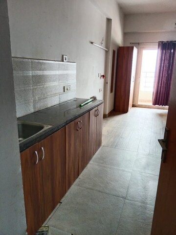 Kitchen in 1 BHK Apartment at Paramount Golfforeste, Zeta I Greater Noida – for Rent