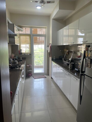 Kitchen in 3.5 BHK Apartment at Emaar Palm Gardens, Sector 83 – for Sale