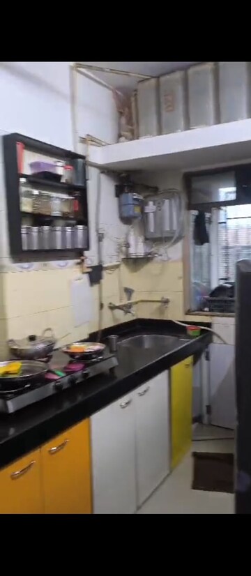 Kitchen in 1 BHK Apartment at Goregaon West View CHS, Goregaon West – for Sale