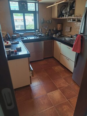 Kitchen in 2 BHK Apartment at Hanuman Sharan CHS, Cumbala Hill – for Sale