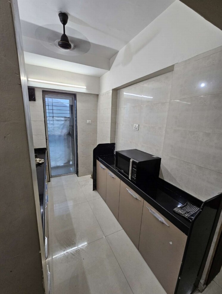 Kitchen, uma-elements 1 Bedroom 472 Sq.Ft. Apartment In Daighar Gaon Thane 8930037