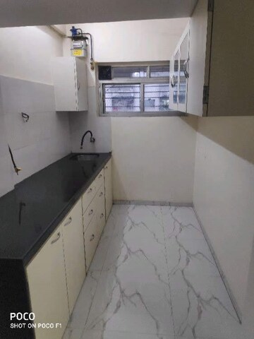 Kitchen in 2 BHK Apartment at Oshiwara Mhada, Andheri West – for Rent