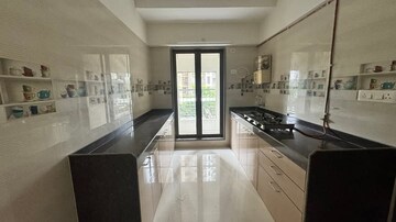 Kitchen in 2 BHK Apartment at Abrol Avirahi Heights, Malad West – for Rent