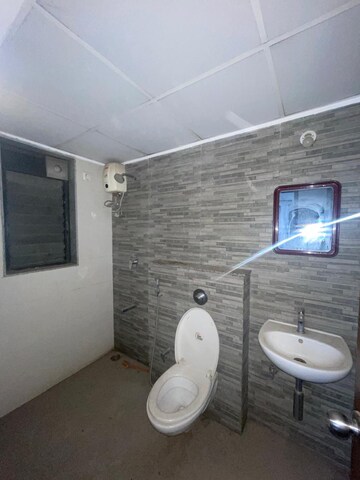 Bathroom in 1.5 BHK Apartment at Lodha Palava City Lakeshore Greens, Dombivli East – for Sale