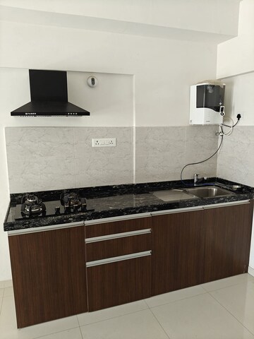 Kitchen in 1 RK Apartment at Gera World of Joy, Kharadi – for Rent