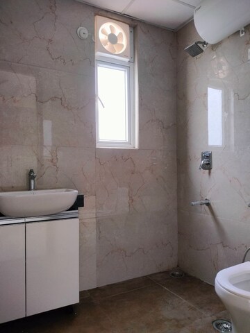 Bathroom in 2.5 BHK Builder Floor at Smart World Gems, Sector 89 – for Rent