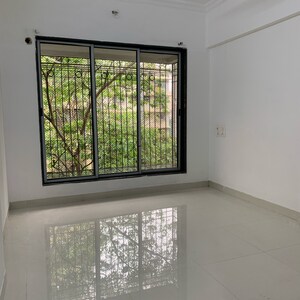 Room in 2 BHK Apartment at Aditya New Ekta CHS LTD, Babhai Naka – for Sale