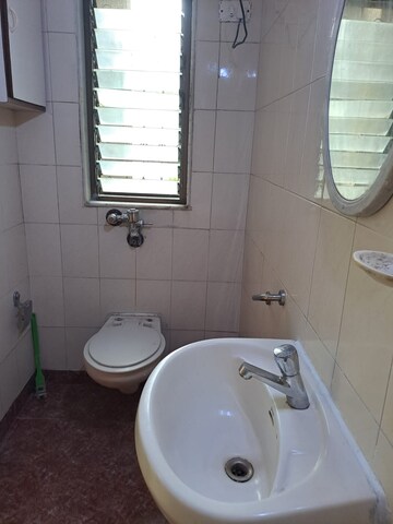 Bathroom in 3 BHK Apartment at Royal Classic Co Op Society, Andheri West – for Rent