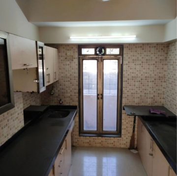 Kitchen in 2 BHK Apartment at Aalap CHS, Hindu Colony – for Rent