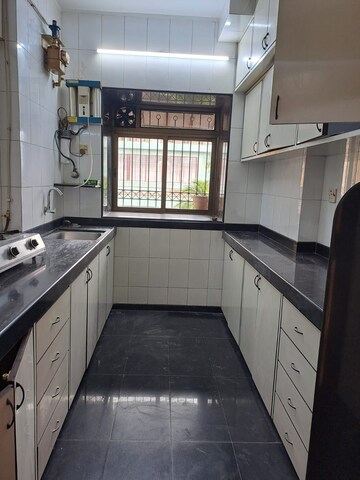 Kitchen in 3 BHK Apartment at Royal Classic Co Op Society, Andheri West – for Rent