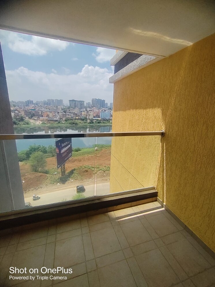 Balcony, planet-millennium-chs 2 Bedroom 830 Sq.Ft. Apartment In Pimple Saudagar Pune 8908371