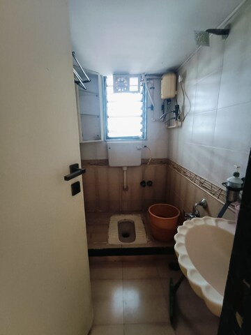 Bathroom in 1 BHK Apartment at Charkop Sector 9 – for Sale