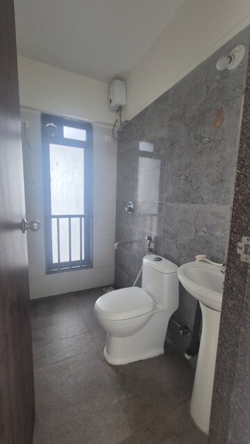 Bathroom in 2 BHK Apartment at Acme Oasis, Kandivali East – for Rent