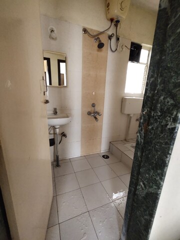 Bathroom in 2 BHK Apartment at Aishwaryam Greens Co-operative Housing Society, Wakad – for Rent