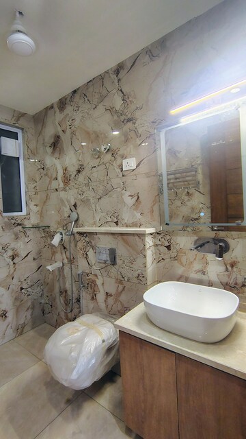 Bathroom in 3.5 BHK Builder Floor at Hong Kong Bazaar, Sector 57 – for Rent