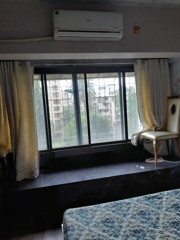 Living Room in 1 BHK Apartment at Philjoy CHS, Borivali West – for Sale