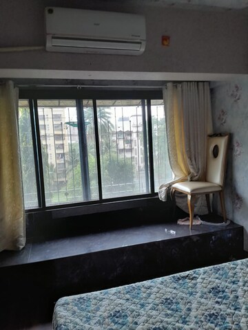 Living Room in 1 BHK Apartment at Philjoy CHS, Borivali West – for Sale