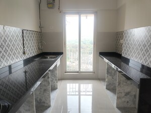 Kitchen in 2 BHK Apartment at Shree Tirupati STG Signature Residency, Patlipada – for Sale