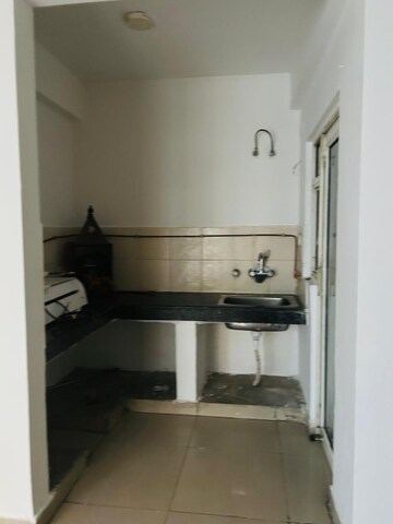 Kitchen in 2 BHK Apartment at Amrapali Dream Valley, Tech Zone 4 Greater Noida – for Rent
