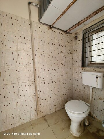 Bathroom in 2 BHK Apartment at Royal Palms Diamond Isle Phase III, Goregaon East – for Sale