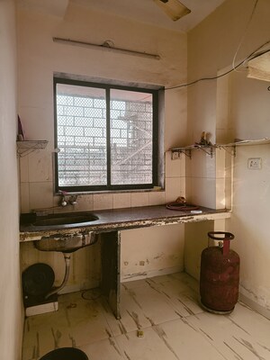 Kitchen in 1 BHK Apartment at Royal Palms Garden View, Goregaon East – for Sale