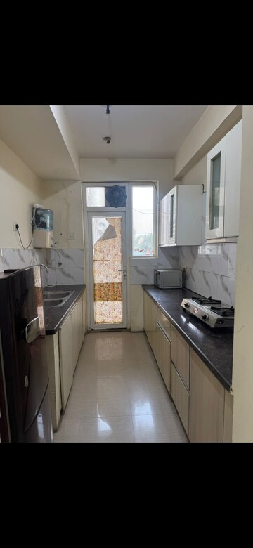 Kitchen in 2 BHK Apartment at NK Sharma Savitry Greens, Lohgarh – for Rent