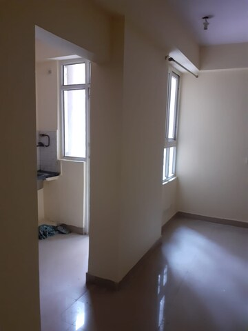 Living Room in 2 BHK Apartment at Galaxy North Avenue ll, Gaur City 2 – for Rent