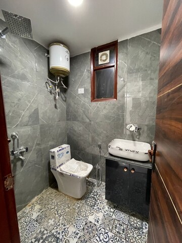 Bathroom in 2 BHK Builder Floor at Chattarpur – for Rent