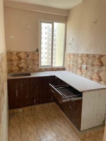 Kitchen in 2 BHK Apartment at Amrapali Golf Homes, Sector 4 Greater Noida – for Rent