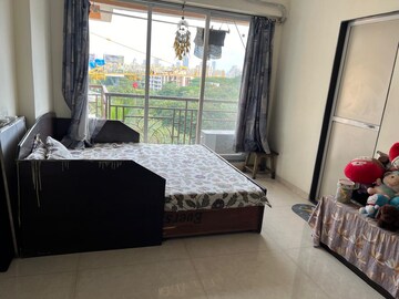 Bedroom in 2 BHK Apartment at Dream Pushpak CHS, Naupada – for Sale