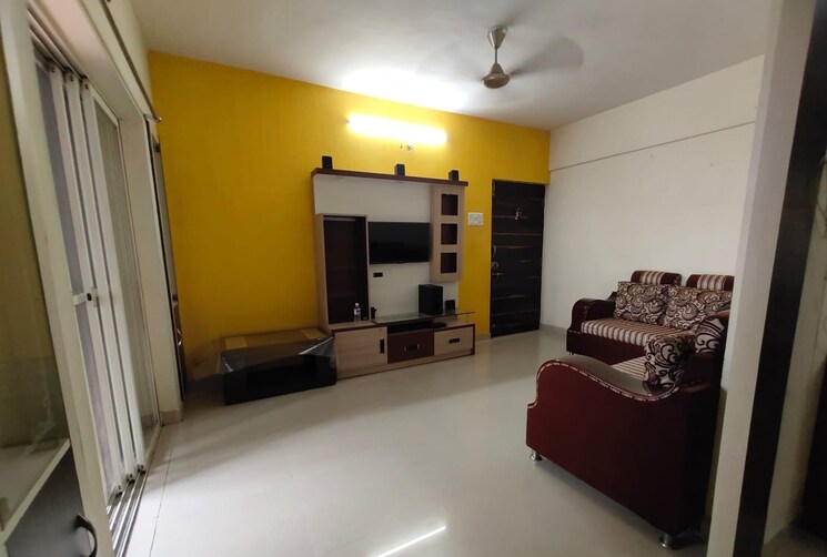 Living Room, aishwaryam-greens-co-operative-housing-society 2 Bedroom 850 Sq.Ft. Apartment In Wakad Pune 8936342